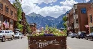 a building with a mountain in the middle of the street