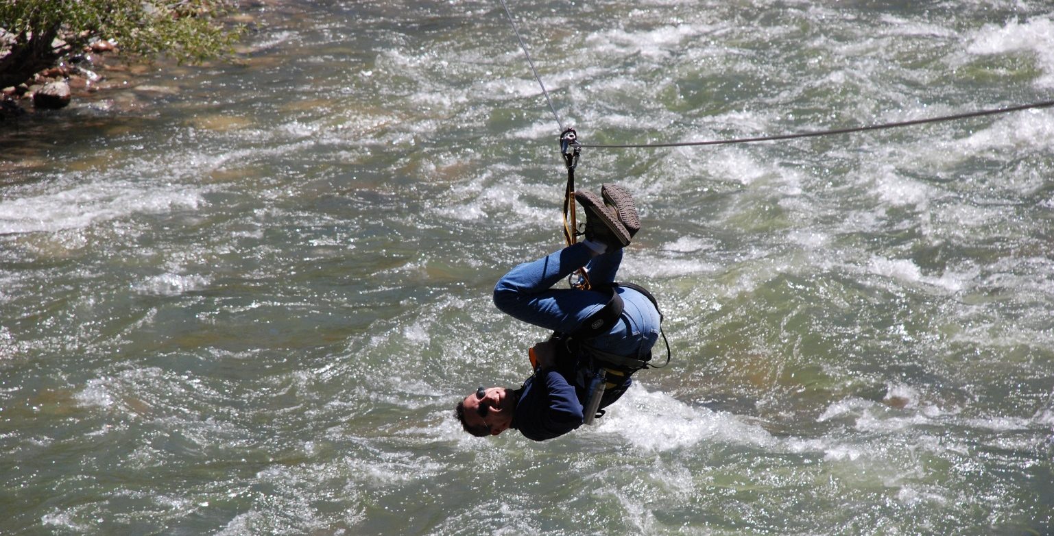 DSC_0354 a man riding a wave on top of a body of water